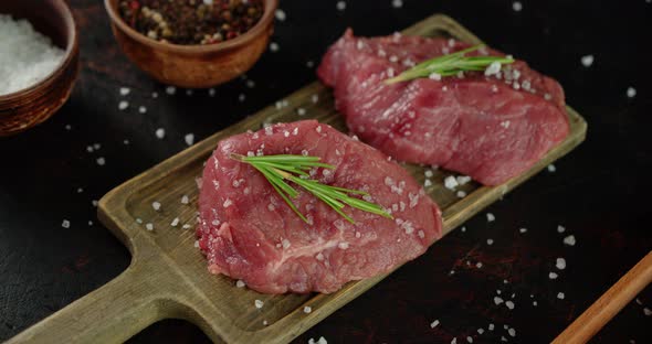Beef Medallions with Rosemary on the Table. alt