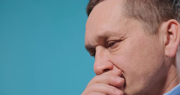 Handsome Man Wipes Mouth on Lips Edges with Fingers Closeup alt