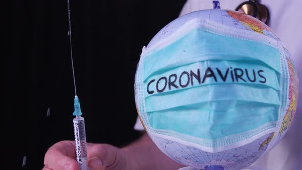 Coronavirus epidemic concept. Doctor holding syringe with COVID-19 vaccine.