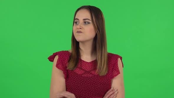 Portrait of Tender Girl in Red Dress Is Waiting. Green Screen alt