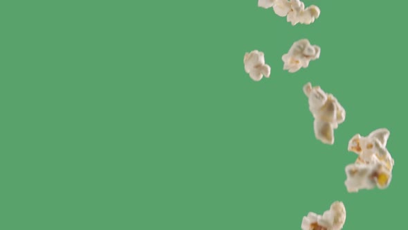Popping Popcorn Flying and Falling Isolated on ChromaKey Background alt