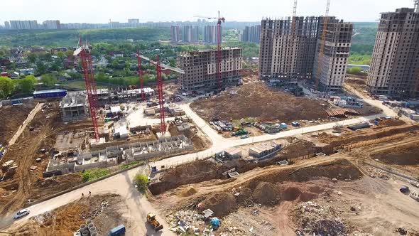 Drone flies over a construction site near Moscow. Construction cranes in the industrial zone. 