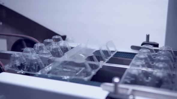 Plastic Packaging on Transporter Belt Factory alt