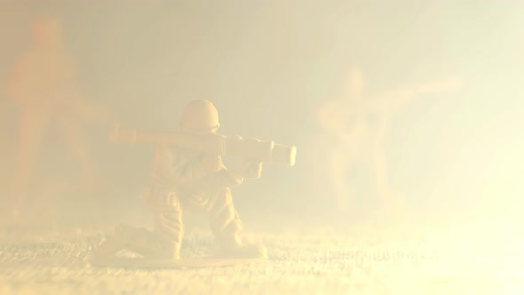 Smoke Envelops a Plastic Toy Soldier Grenade Launcher alt