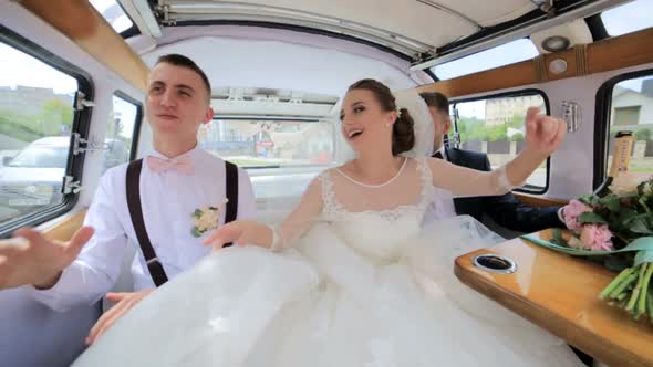 Bridesmaids and Groomsmen Dance While Sitting in the Limousine alt