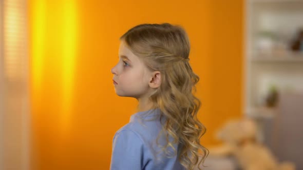 Lovely Sad Little Girl Turning and Looking to Camera, Family Problems, Adoption alt