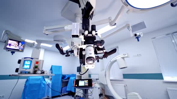 Innovative microscope inside the operating room. Empty surgery with modern medical equipment alt