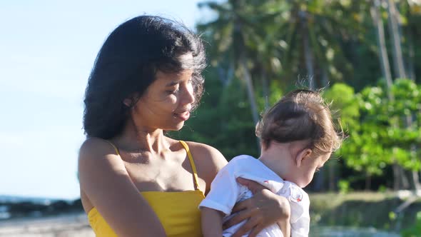 Close Up of Happy Young Filipino Mother with Mixed Race Baby Boy