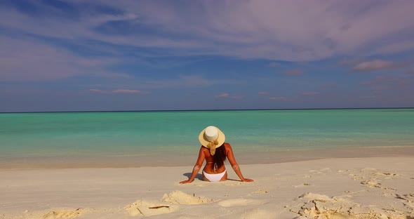 Sexy beauty model travelling in the sun at the beach on summer white sandy and blue alt
