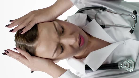 Vertical Shot Attractive Female Doctor is Experiencing Severe Headache and Fatigue