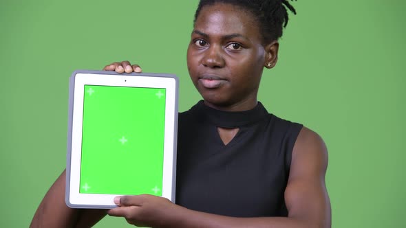 Young Beautiful African Businesswoman Showing Digital Tablet