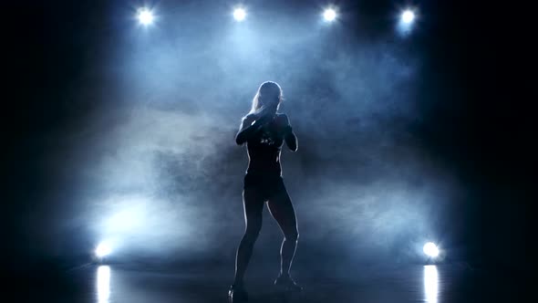 Girl Boxer Moves Quickly Striking Hands in Different Directions alt