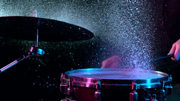 Super Slow Motion Shot of Drum Hit and Splashing Water at 1000 Fps alt