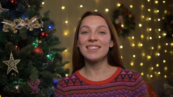 Smiling Woman Wishing a Merry Christmas