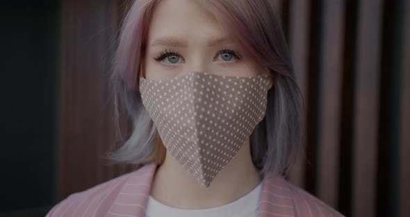 Closeup Portrait of Goodlooking Girl Student Wearing Fabric Face Mask Indoors alt