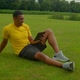 Cheerful Relaxed Sporty African Man Watching Fitness Video on Tablet Pc in Park - VideoHive Item for Sale