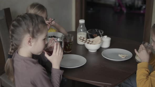 Children at Home at Breakfast