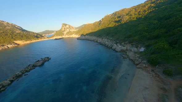 Drone Over Controller And Sunlit Corfu Landscape alt