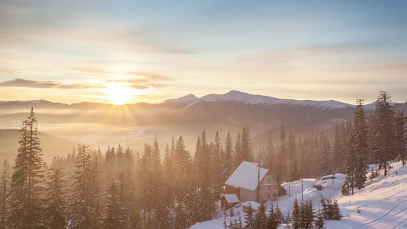 Foggy Morning in the Winter Mountains Forest on the Background of Dramatic Cloudy Sky. Timelapse. 4K