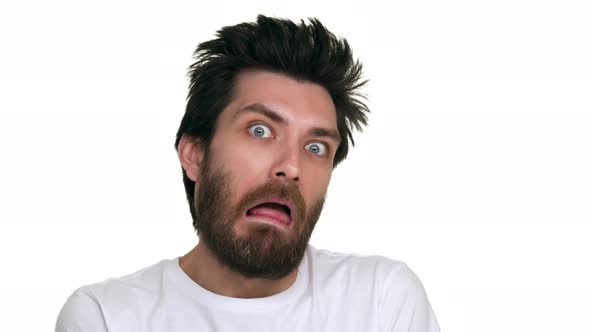 Caucasian Man Making Foolish Faces on White Background alt