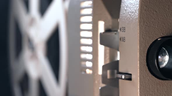 Oldfashioned 8Mm Film Projector Demonstrating Tape Movie alt