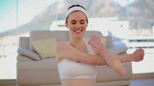Content Smiling Woman Stretching Her Arms