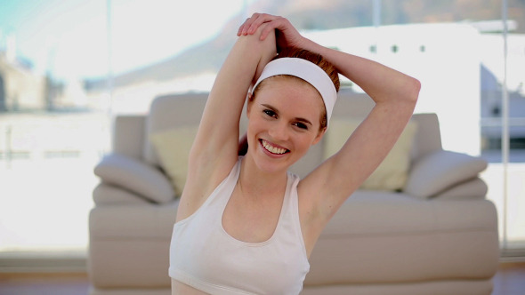 Lovely Sporty Woman Stretching Her Arms