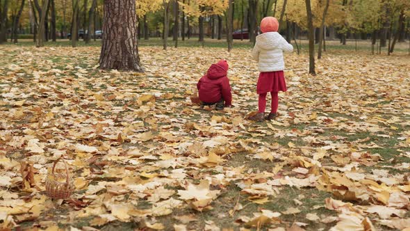 Two Happy Funny Children Kids Boy Girl Walking in Park Forest Enjoying Autumn Fall Nature Weather alt