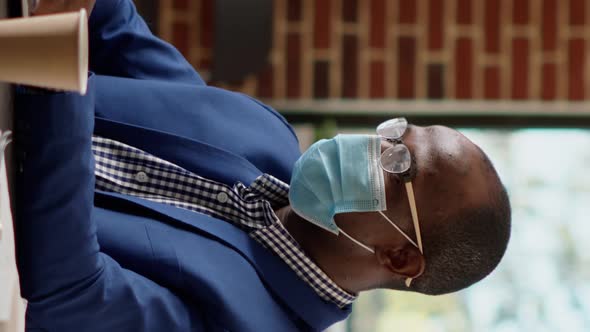 Vertical Video Pensive Male Consultant Thinking About Financial Strategy alt