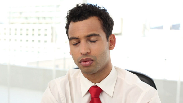 Frowning Handsome Businessman Having Neck Pain