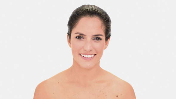 Attractive Brunette Woman Plucking Her Eyebrow alt