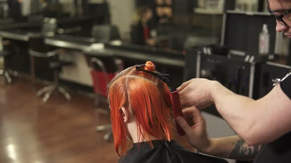 Young Woman Getting Her Hair Dressed in Hair Salon alt