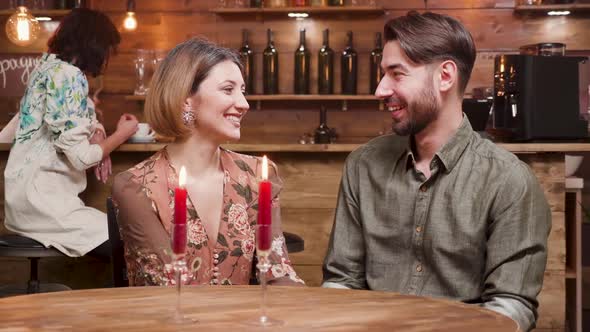 Young Beautiful Couple Clinking Glasses with Wine alt