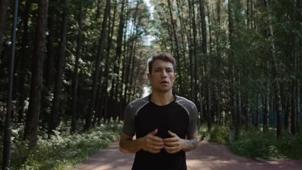 Young Handsome Man Train for Marathon Run in Park