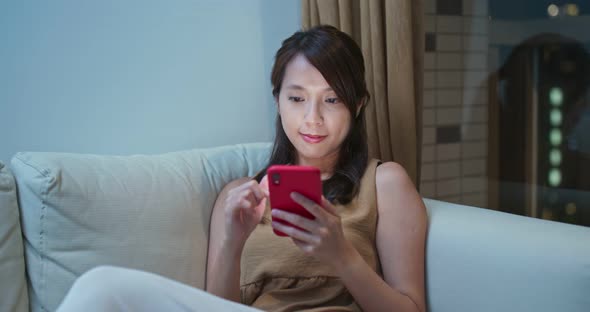 Woman use of smart phone at home alt