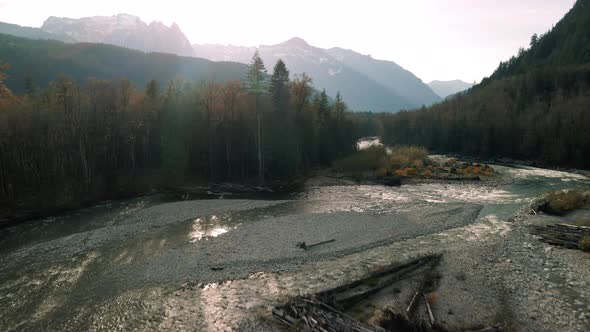 Stunning Fall Season Aerial Over Forest River With Mountain Range Background alt
