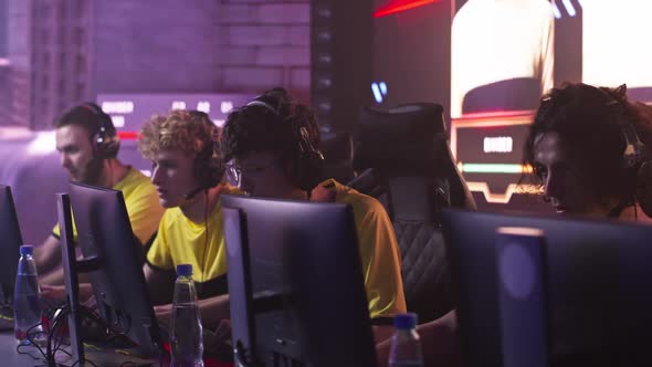 Young Gamers Celebrating Victory in Match alt