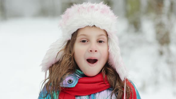 Little Girl on Face Surprised Child Having Fun Enjoying Winter Day