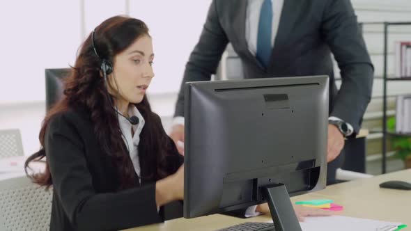 Business People Wearing Headset Working in Office alt