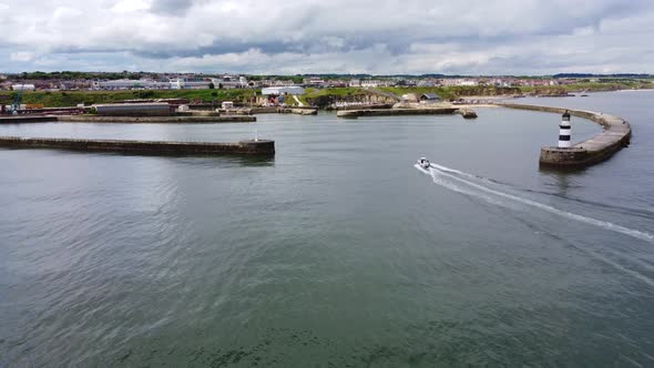 Aerial Drone Shot Reversing Upwards Over Seaham Harbour and Lighthouse alt