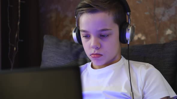 Young Boy at Home with Laptop