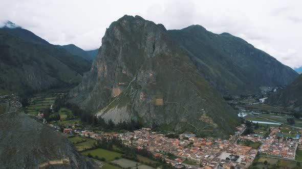 Flying over of Ollantaytambo, Incas city in Peru 4K alt