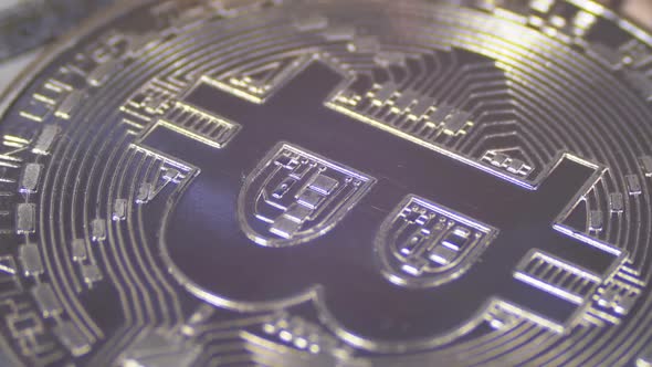 Silver Bitcoin Coin Cryptocurrency BTC Rotate on Background with US Dollars alt