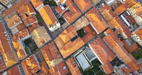 Drone at Sunset Takes Off Over the Roofs of the Old City in Dubrovnik Horvtia