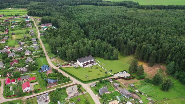 Top View of the Wedding Venue in a Green Field and a House in the Village Near the Forest. Wedding alt