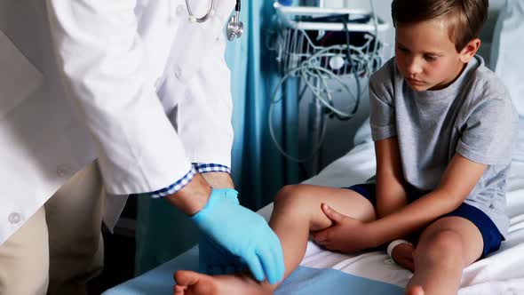 Male doctor examining patient alt