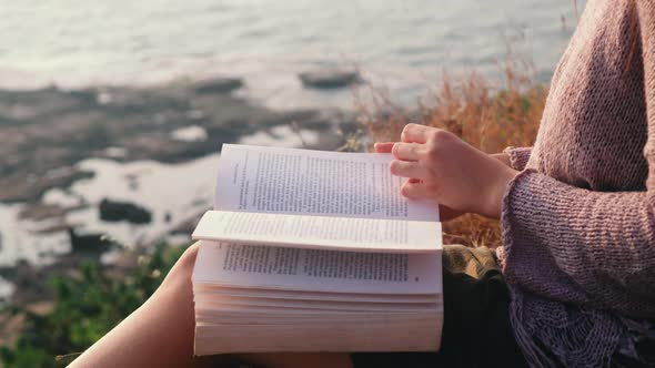 One asian woman and a book with sea view alt