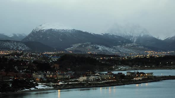 Mist rolling over Snow Covered Patagonian Mountains in Ushuaia, Argentina. alt