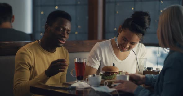 Black Guy Sharing Feeling with Friends in Post Pandemic Times alt