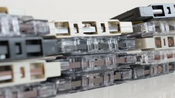 Music archives on old compact  audio cassettes close-up 4K 2160p 30fps UltraHD tilting footage - Ret alt